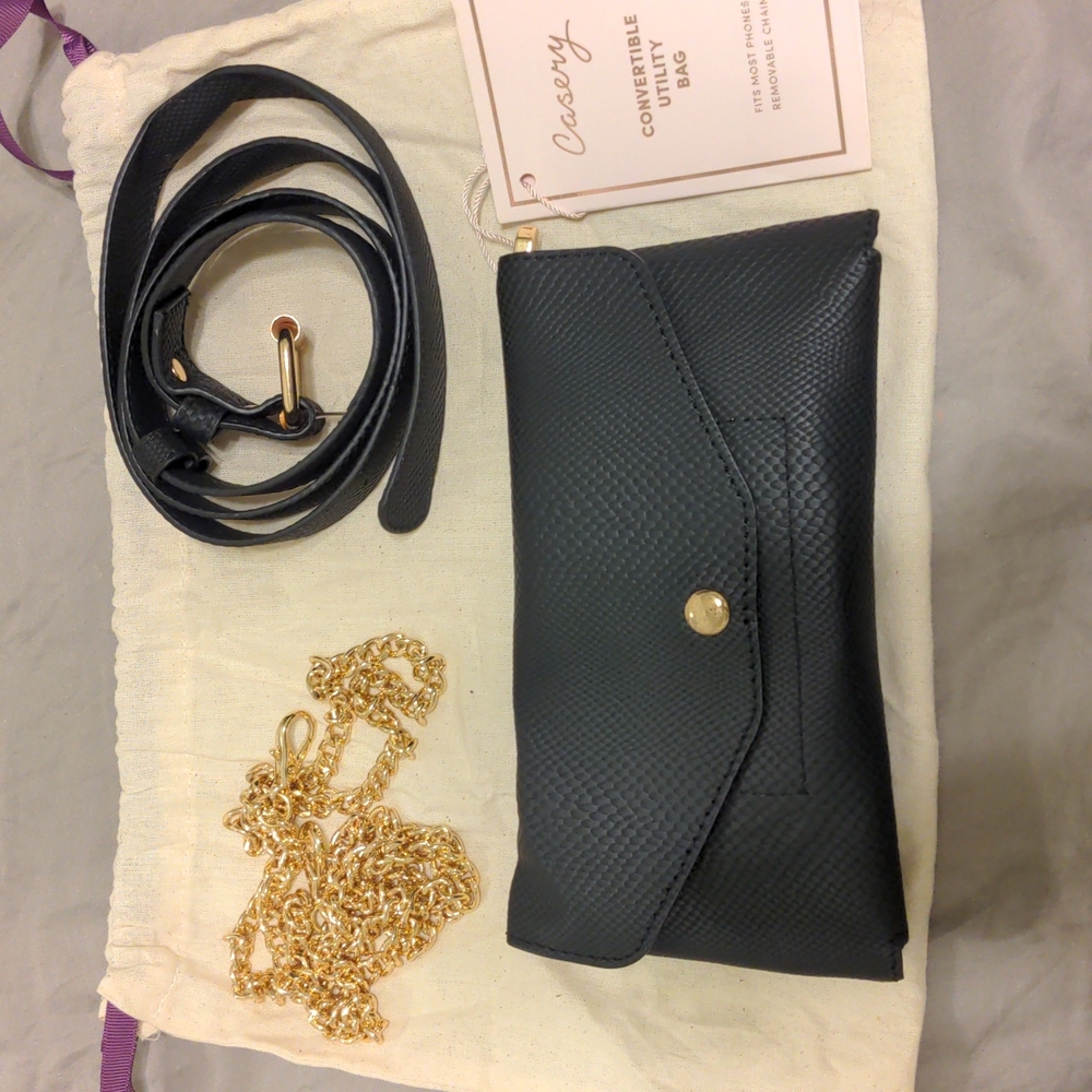 The Casery black leather convertible utility bag. Clutch, belt, & chains. NWT